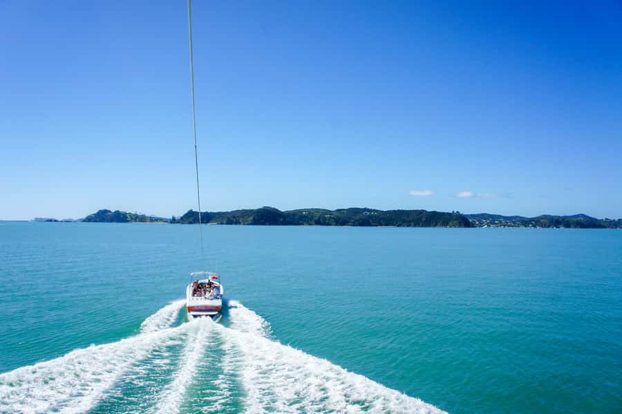 Bay of Islands: Parasail, Paihia and Russell - Rising above Paihia on a bright Smiley parachute