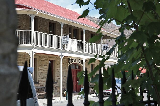 Dunedin to Queenstown One Way Tour Including Taieri Gorge Train - Starting beneath Dunedin’s grand railway station