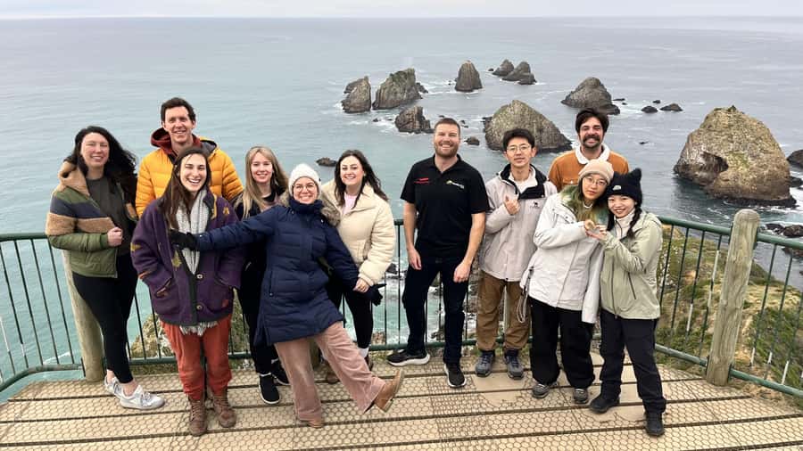 Dunedin to Te Anau via The Catlins & Invercargill 1 Way Tour - Nugget Point Lighthouse and the sea stacks below