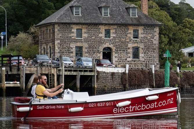 Electric Boats to explore Kerikeri river - Taking the wheel at Waipapa Landing