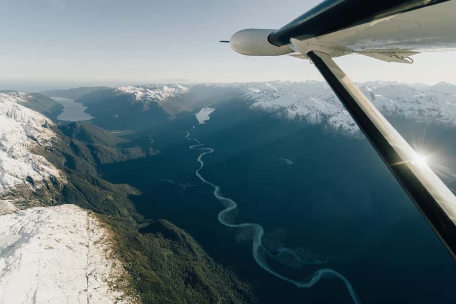 From Queenstown: Milford Sound Full-Day Trip by Plane & Boat - Pickup, weather checks, and Queenstown departure