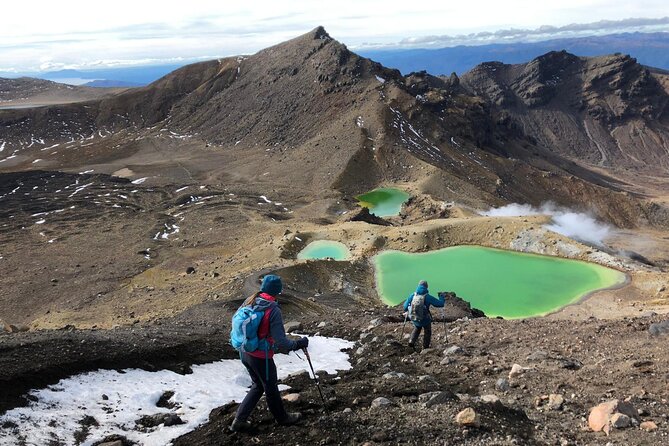 Private Tongariro Crossing Guided Walk - Climbing toward the saddle between the volcanoes