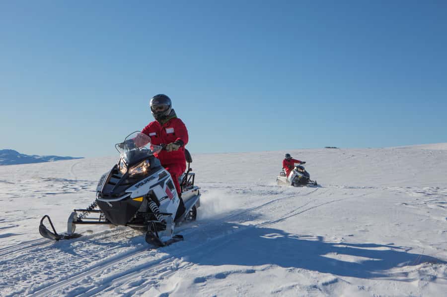 Queenstown: Snowmobiling Experience with Helicopter Flight - Riding through the Garvie snow