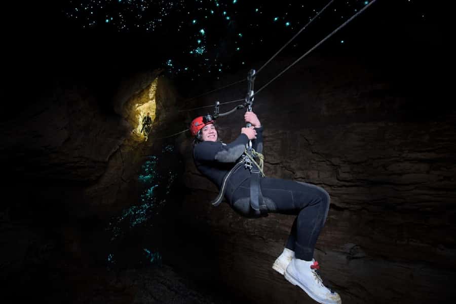 Waitomo Caves Black Abyss Ultimate Caving Experience - Climbing waterfalls inside Ruakuri Cave